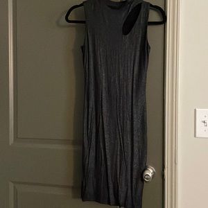 Small black metallic dress with shoulder cutout.